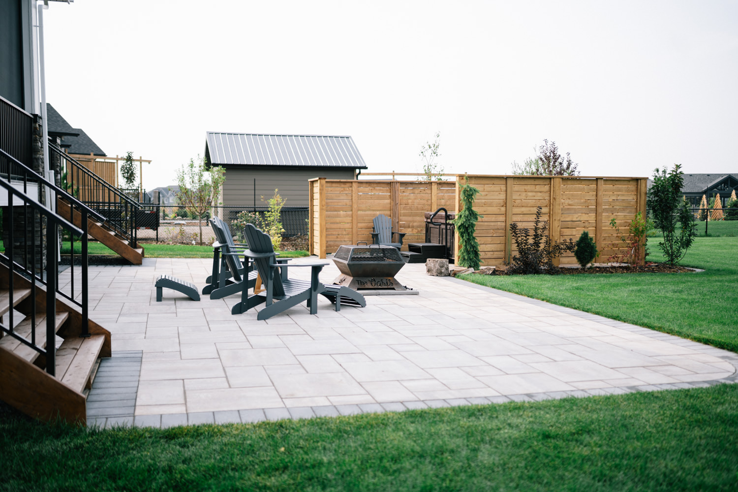 Stone patio in a Green Haven acreage yard in Okotoks