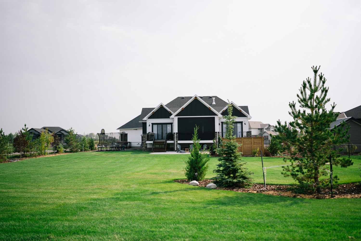 Overview of a landscaped Green Haven acreage yard in Okotoks
