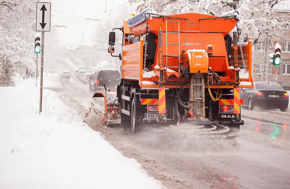 Kayben winter crew member for commercial snow and ice work